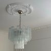 Handblown Murano tubular chandelier with 36 glass prisms under an ornate ceiling rose
