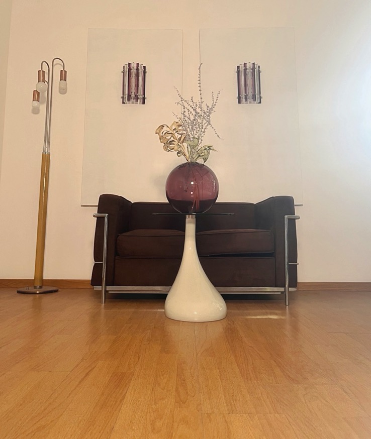 Pair of amethyst Murano triedri column wall sconces mounted on a wall