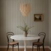 Handblown beige Murano drop chandelier over a dining table
