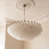 Handblown Murano Alabaster Chandelier – 185 Alabaster Glass under an ornate ceiling rose