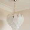 Handblown Murano Carved Chandelier – Medium under an ornate ceiling rose