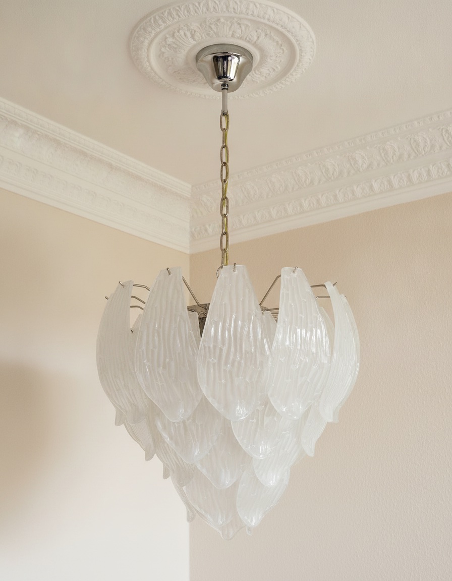 Handblown Murano Carved Chandelier – Medium under an ornate ceiling rose