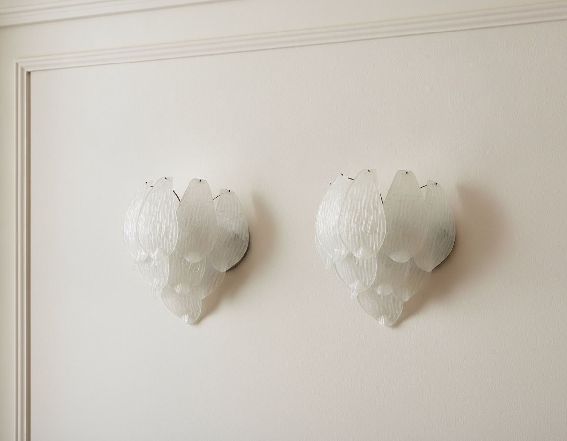 Handblown Murano Carved Wall Sconce – Set of 2 under an ornate ceiling rose