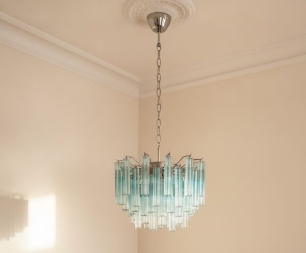 Handblown Murano Quadriedri Chandelier – 107 Quadriedri Glass under an ornate ceiling rose