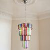 Handblown Murano Quadriedri Chandelier – 111 Quadriedri Glass under an ornate ceiling rose