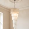 Handblown Murano Quadriedri Chandelier – 166 Quadriedri Glass under an ornate ceiling rose