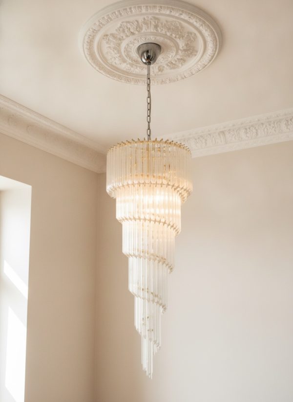 Handblown Murano Quadriedri Chandelier – 166 Quadriedri Glass under an ornate ceiling rose