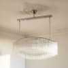 Handblown Murano Quadriedri Chandelier – 292 Quadriedri Glass under an ornate ceiling rose