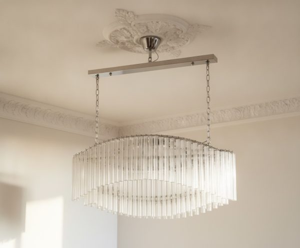 Handblown Murano Quadriedri Chandelier – 292 Quadriedri Glass under an ornate ceiling rose