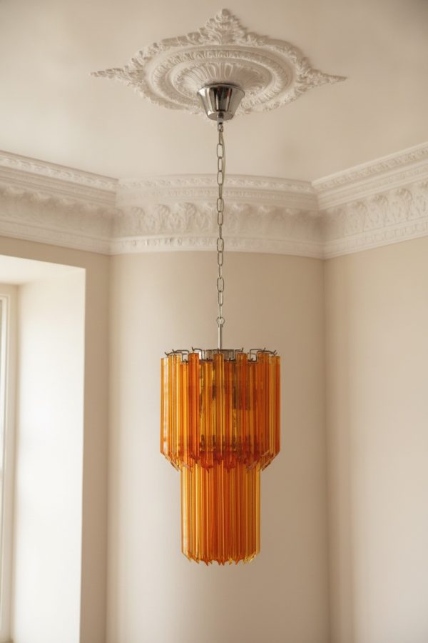 Handblown Murano Quadriedri Chandelier – 46 Quadriedri Glass under an ornate ceiling rose