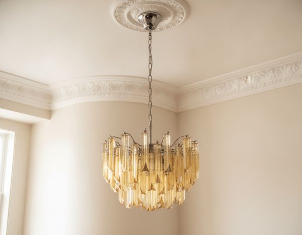 Handblown Murano Triedri Chandelier – 107 Triedri Glass under an ornate ceiling rose