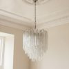 Handblown Murano Triedri Chandelier – 92 Triedri Glass under an ornate ceiling rose