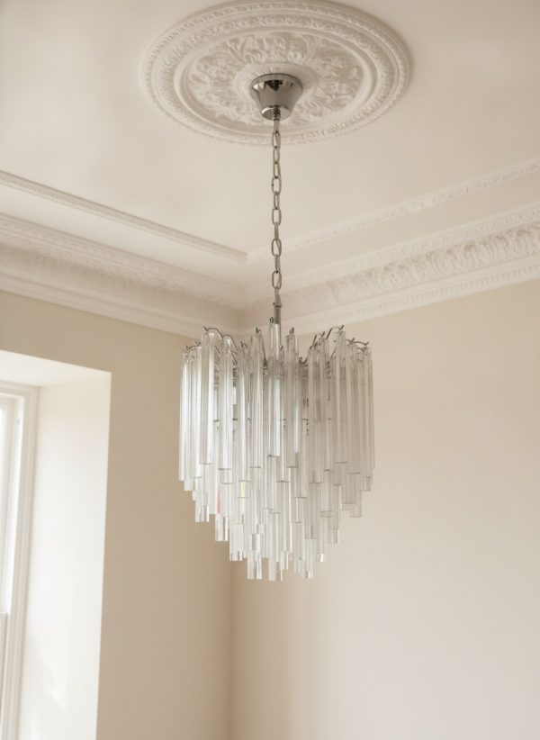 Handblown Murano Triedri Chandelier – 92 Triedri Glass under an ornate ceiling rose