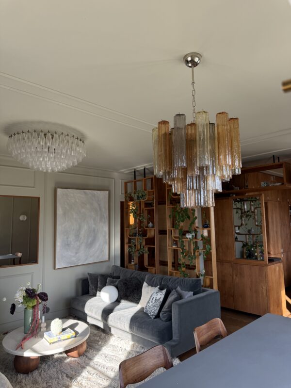 Multicolour Murano tubular chandelier with amber, smoked and clear glass prisms in a living room