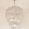 Transparent Corteccia Murano Tiered Chandelier – 80 Glass Tubes under an ornate ceiling rose