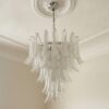 Transparent Murano Petal Chandelier – 52 Glass Petals under an ornate ceiling rose